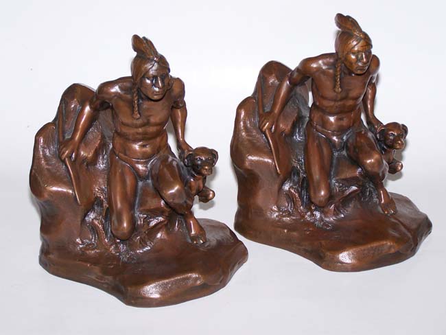 A stunning pair of Antique Bookends circa 1930 depicting an Indian with his dog